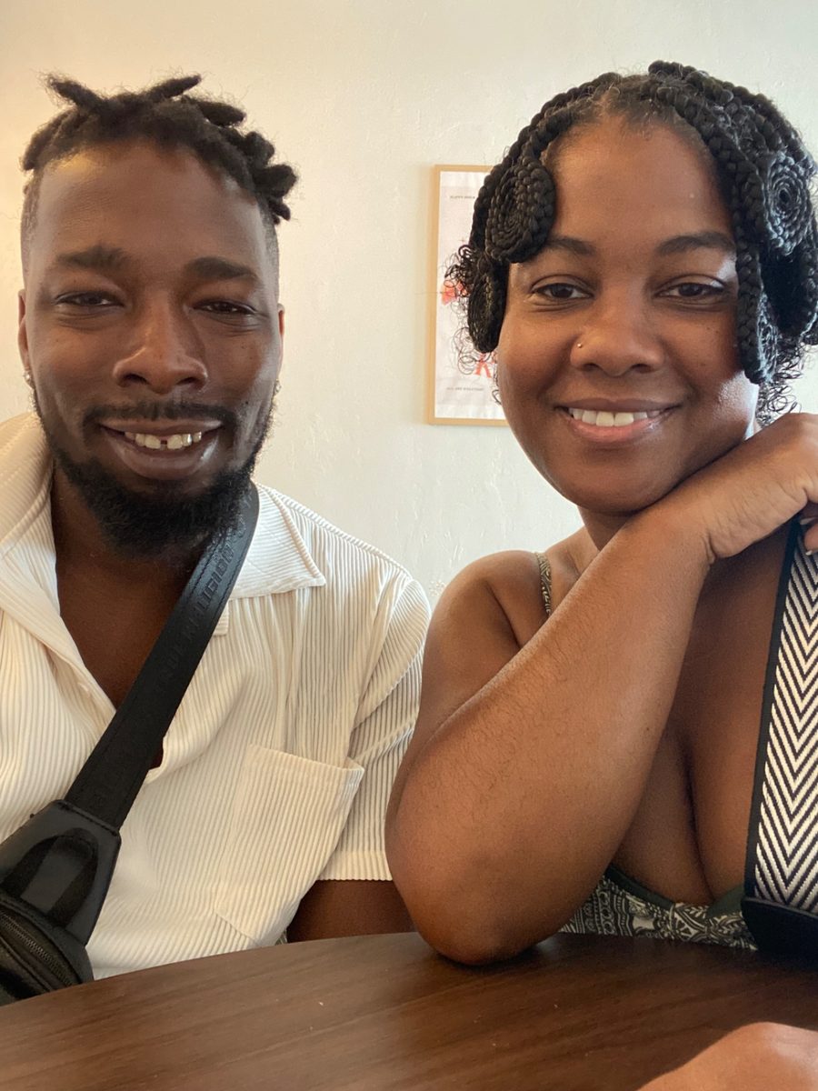 Fallon and her husband sitting together at a table